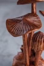 Wooden mushroom sculpture on a gray background