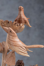 Artisan bird on mushroom wood carving