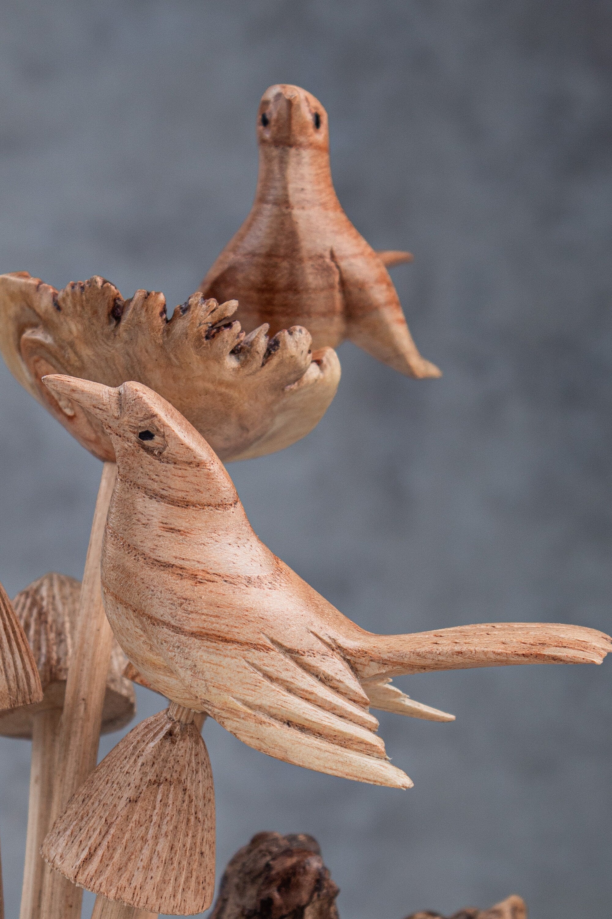 Artisan bird on mushroom wood carving