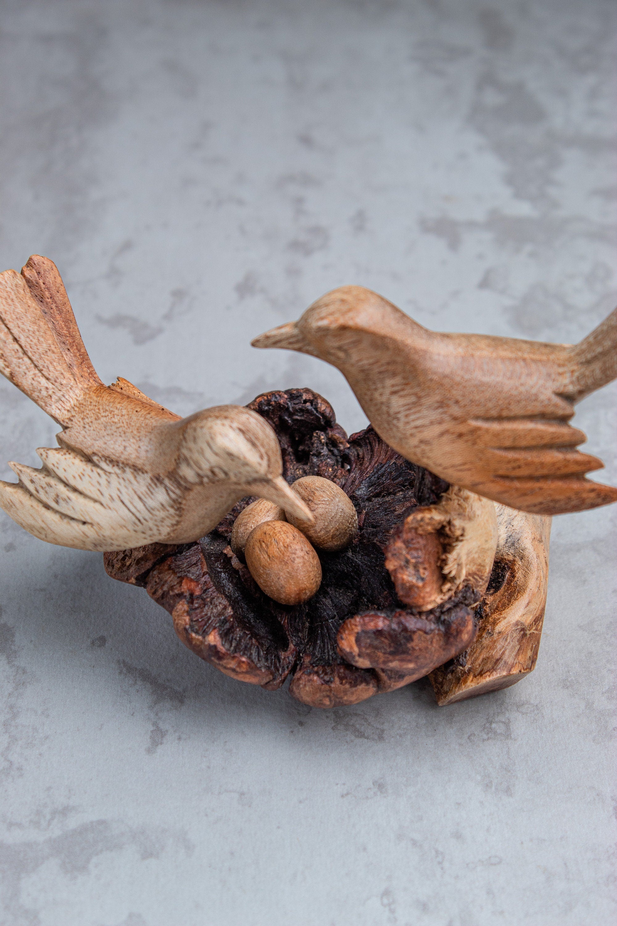Artisan birds on nest wood carving handmade