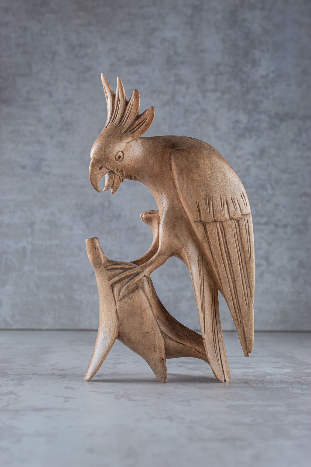 Hand-carved wooden cockatoo parrot sculpture