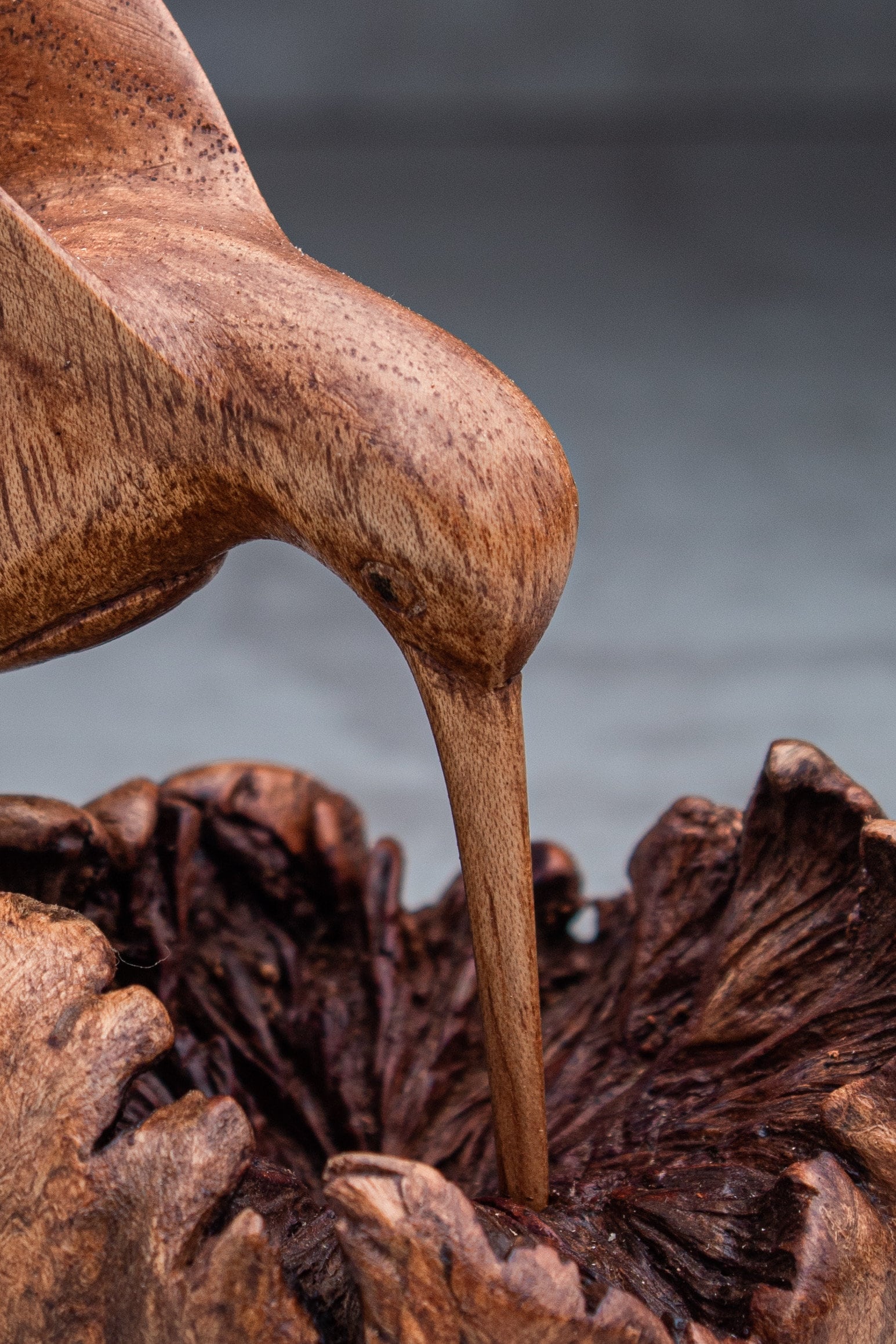 Unique hummingbird building nest wooden figurine