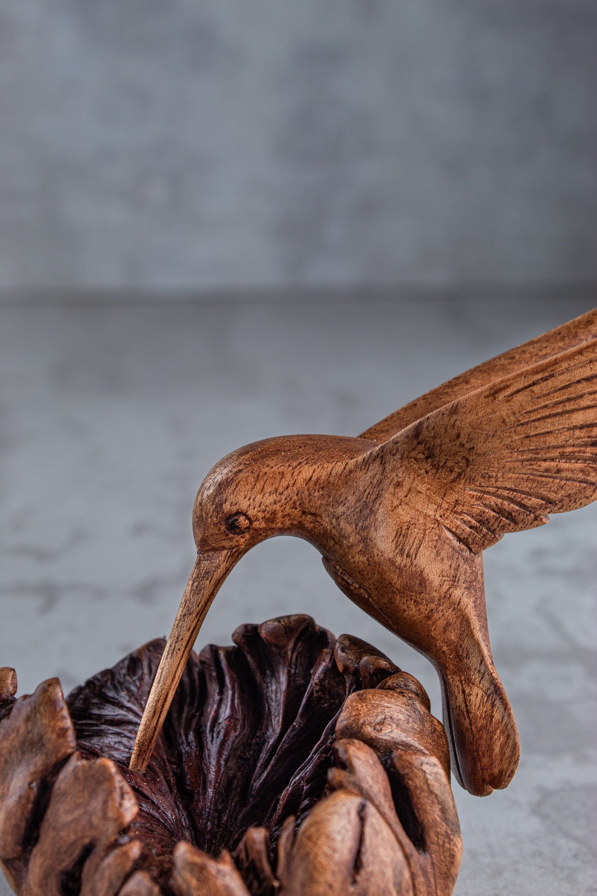 Unique hummingbird building nest wooden figurine